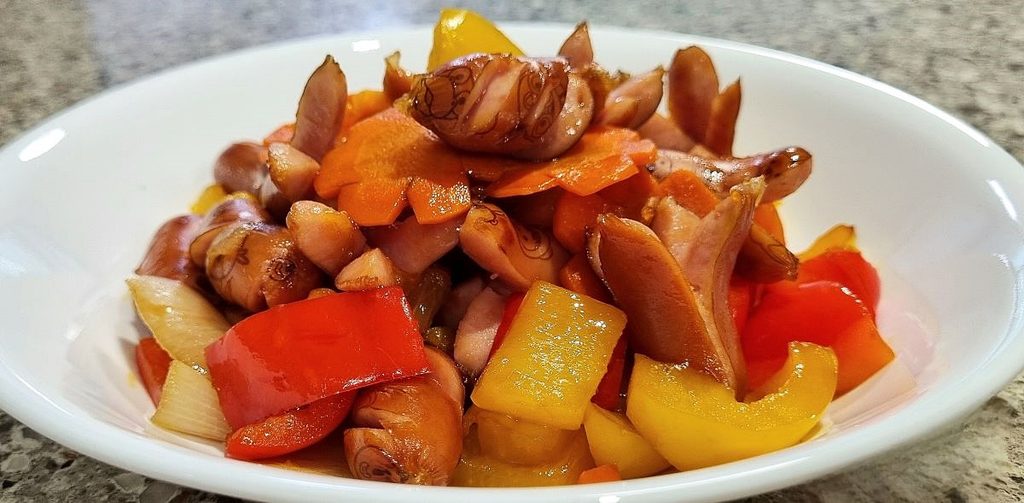 Mild Korean sausage and vegetable stir-fry with bell peppers, carrots, and onions